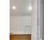 Hallway shows hardwood floors, neutral walls, and a glimpse into another room. It has a vent on the floor at 934 Hope Dr, Atlanta, GA 30310
