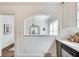 Charming kitchen view through archway features stainless steel appliances and two-tone cabinets at 934 Hope Dr, Atlanta, GA 30310