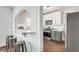 Kitchen view highlights the breakfast bar, stainless steel appliances, and two-tone cabinets at 934 Hope Dr, Atlanta, GA 30310