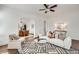 Bright living room boasts an elegant area rug, a modern fan, and a seamless archway to the dining area at 934 Hope Dr, Atlanta, GA 30310