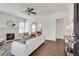 Bright living room with a decorative fireplace, white walls and hardwood floors at 934 Hope Dr, Atlanta, GA 30310