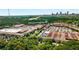 Expansive aerial view showcasing a bustling commercial district surrounded by lush greenery and the city skyline at 1307 Glenwood Se Ave, Atlanta, GA 30316