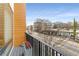 Balcony of the home in a busy neighborhood street with greenery and commercial buildings at 1307 Glenwood Se Ave, Atlanta, GA 30316