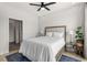 Cozy bedroom with a blue rug, a ceiling fan, and hardwood floors at 1307 Glenwood Se Ave, Atlanta, GA 30316
