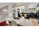 Open-concept dining room flows into a modern kitchen with sleek black cabinets and stainless steel appliances at 1307 Glenwood Se Ave, Atlanta, GA 30316