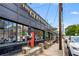 Street-level of a building with large windows, outdoor seating, and a brick facade at 1307 Glenwood Se Ave, Atlanta, GA 30316