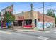 Corner building with retro pizza sign and colorful mural, displaying vintage charm and street presence at 1307 Glenwood Se Ave, Atlanta, GA 30316