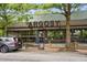 Exterior of a building with large windows, wood accents, and a stylishly landscaped entrance at 1307 Glenwood Se Ave, Atlanta, GA 30316