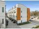Modern townhome exteriors with private garages and contemporary design elements along a city street at 1307 Glenwood Se Ave, Atlanta, GA 30316