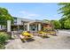 Modern restaurant exterior with bright yellow picnic tables and outdoor seating at 1307 Glenwood Se Ave, Atlanta, GA 30316
