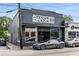 Contemporary building with a dark facade, large windows, and modern architecture, featuring the 'Banshee' sign at 1307 Glenwood Se Ave, Atlanta, GA 30316