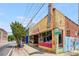 Street-level exterior view of a two-story building with brickwork and a large 'Pizza' sign on top at 1307 Glenwood Se Ave, Atlanta, GA 30316