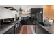 Stylish kitchen showcasing black cabinets, stainless steel appliances, and minimalist design elements at 1307 Glenwood Se Ave, Atlanta, GA 30316