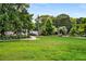 Expansive green lawn surrounded by lush trees and landscaping at 1307 Glenwood Se Ave, Atlanta, GA 30316