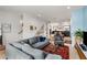 Inviting living room featuring an open floor plan and modern furnishings and decor with a view to the upstairs at 1307 Glenwood Se Ave, Atlanta, GA 30316