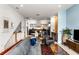 Open concept living room with modern decor flowing into a stylish kitchen and dining area at 1307 Glenwood Se Ave, Atlanta, GA 30316