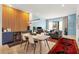 Open-concept living space featuring a wood accent wall, modern furnishings, and a door to the outside at 1307 Glenwood Se Ave, Atlanta, GA 30316