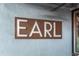 Close-up of the 'EARL' sign on a textured wall, showing vintage lettering and aged appearance at 1307 Glenwood Se Ave, Atlanta, GA 30316
