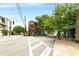 Street view highlighting a brick building with outdoor seating, surrounded by lush trees at 1307 Glenwood Se Ave, Atlanta, GA 30316