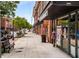Street view of a commercial area with brick buildings, benches, and pedestrian-friendly sidewalks at 1307 Glenwood Se Ave, Atlanta, GA 30316