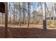 Lush, wooded backyard, featuring mature trees and natural groundcover at 150 Hartwood Dr, Woodstock, GA 30189