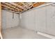 Unfinished basement with exposed beams and concrete walls provides a blank canvas for customization at 150 Hartwood Dr, Woodstock, GA 30189
