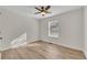 Bedroom features a ceiling fan, window, hardwood floors and light colored walls at 150 Hartwood Dr, Woodstock, GA 30189