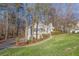 Well-kept home on a large lot surrounded by mature trees at 150 Hartwood Dr, Woodstock, GA 30189