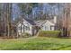 Lovely tan home with lush green lawn, perfect for enjoying the outdoors at 150 Hartwood Dr, Woodstock, GA 30189