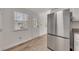 Spacious kitchen with stainless steel appliances, granite counters, and backyard access at 150 Hartwood Dr, Woodstock, GA 30189