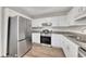 Bright kitchen features stainless steel appliances and granite countertops at 150 Hartwood Dr, Woodstock, GA 30189