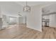 Open-concept living room with hardwood floors, fireplace, and stainless steel appliances at 150 Hartwood Dr, Woodstock, GA 30189