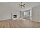 Inviting living room with fireplace, ceiling fan, and natural light at 150 Hartwood Dr, Woodstock, GA 30189