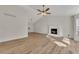Bright living room with wood floors and cozy fireplace at 150 Hartwood Dr, Woodstock, GA 30189