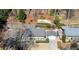 Aerial view of a home featuring a manicured lawn and outdoor patio with seating at 2344 Sagamore Hills Dr, Decatur, GA 30033
