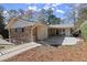 Back of a brick home featuring a balcony, a patio and a walkway at 2344 Sagamore Hills Dr, Decatur, GA 30033