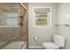 Bathroom showcasing a tiled shower and a window at 2344 Sagamore Hills Dr, Decatur, GA 30033