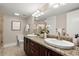 Bathroom with granite countertops, double sinks, and a tile floor at 2344 Sagamore Hills Dr, Decatur, GA 30033