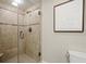 Bathroom featuring a glass enclosed shower, tile surround, and modern fixtures at 2344 Sagamore Hills Dr, Decatur, GA 30033