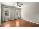Bright bedroom featuring hardwood floors, neutral walls, a ceiling fan and large windows at 2344 Sagamore Hills Dr, Decatur, GA 30033