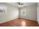 Bright bedroom with hardwood floors, neutral walls, a ceiling fan, closet and windows at 2344 Sagamore Hills Dr, Decatur, GA 30033