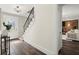 Bright entryway with hardwood floors, stairs to the second floor, and entry to the living room at 2344 Sagamore Hills Dr, Decatur, GA 30033