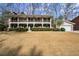 Charming two-story home with a welcoming front porch, shutters, and a well-kept lawn at 2344 Sagamore Hills Dr, Decatur, GA 30033