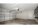 Spacious garage with a white door, ample lighting, and side storage at 2344 Sagamore Hills Dr, Decatur, GA 30033