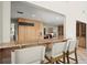 Kitchen view showing a breakfast bar with seating and custom cabinetry at 2344 Sagamore Hills Dr, Decatur, GA 30033