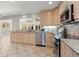 Kitchen with stainless steel appliances, granite counters, and tile flooring at 2344 Sagamore Hills Dr, Decatur, GA 30033
