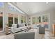 Bright living room featuring large windows, a vaulted ceiling and neutral decor at 2344 Sagamore Hills Dr, Decatur, GA 30033