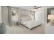 Main bedroom with a large window, carpet flooring, and a king bed with lots of pillows at 2344 Sagamore Hills Dr, Decatur, GA 30033