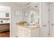 Well-lit bathroom featuring a single vanity, granite countertops, and decorative wall art at 24 Rockland Pl, Decatur, GA 30030