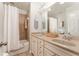 Clean bathroom with double vanity, shower-tub combo, and neutral color palette at 24 Rockland Pl, Decatur, GA 30030